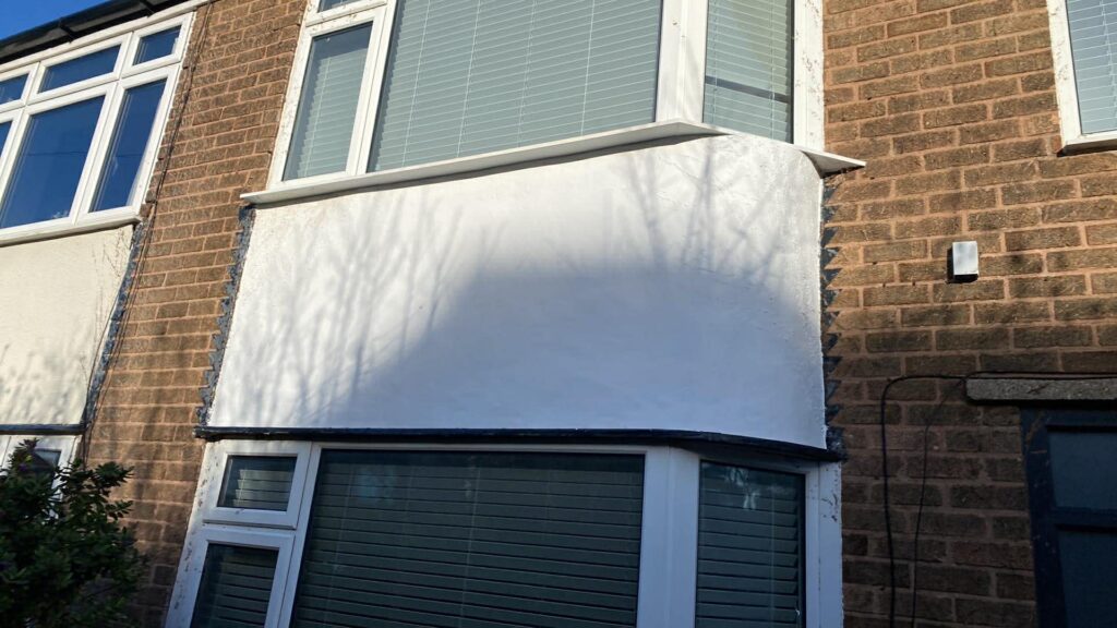 Front wall after ivy removal and painting with a fresh white finish on a house in Sheffield