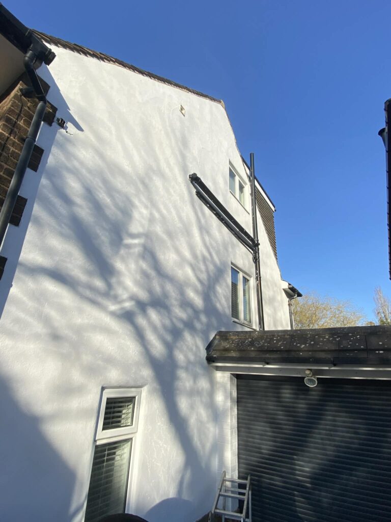 Side wall after ivy removal and exterior painting on a house in Sheffield
