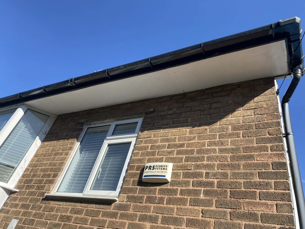 Freshly painted white soffits on a house in Sheffield after exterior restoration work