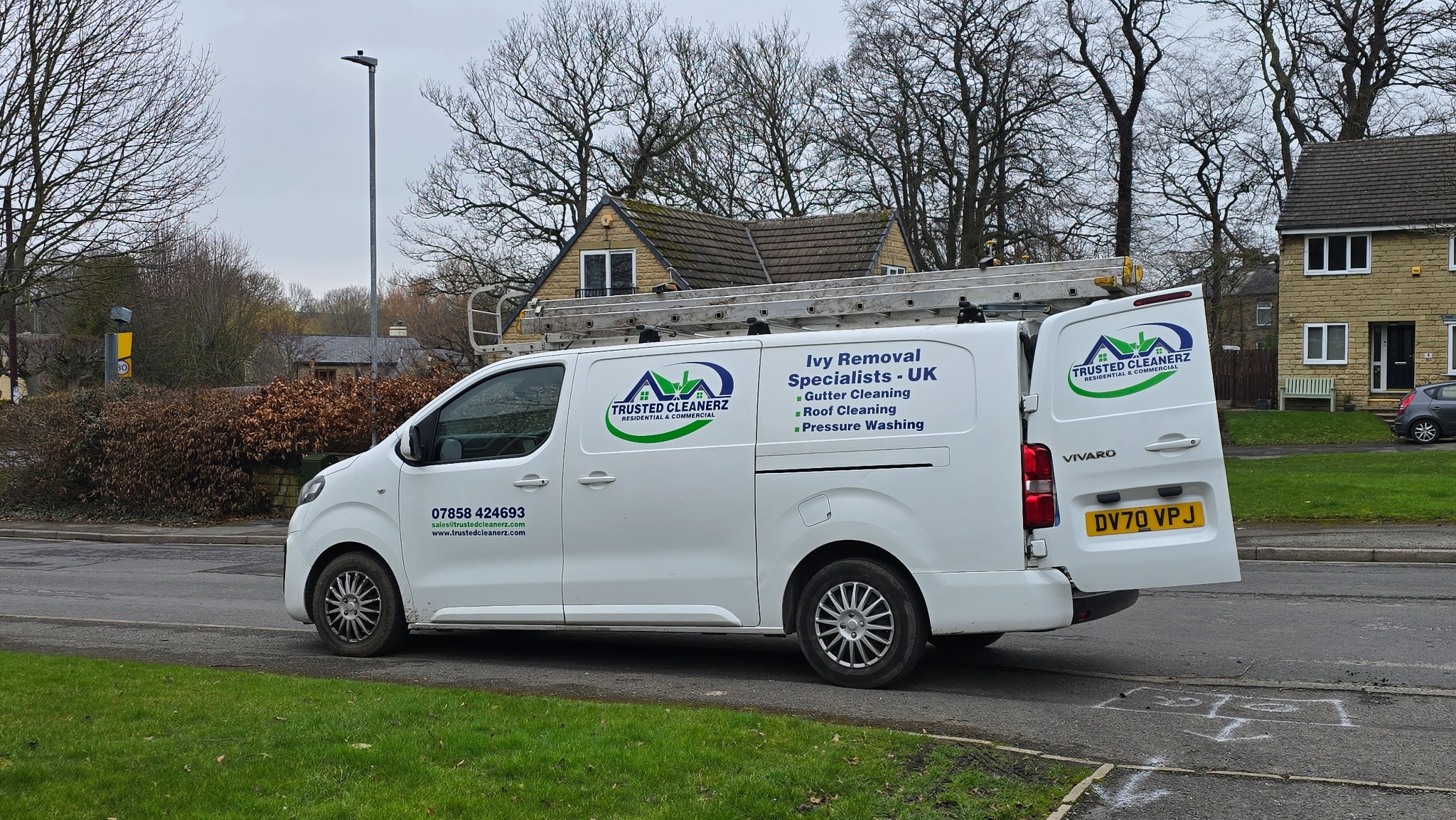 Trusted Cleanerz Ltd branded exterior cleaning and ivy removal van with professional ladder systems