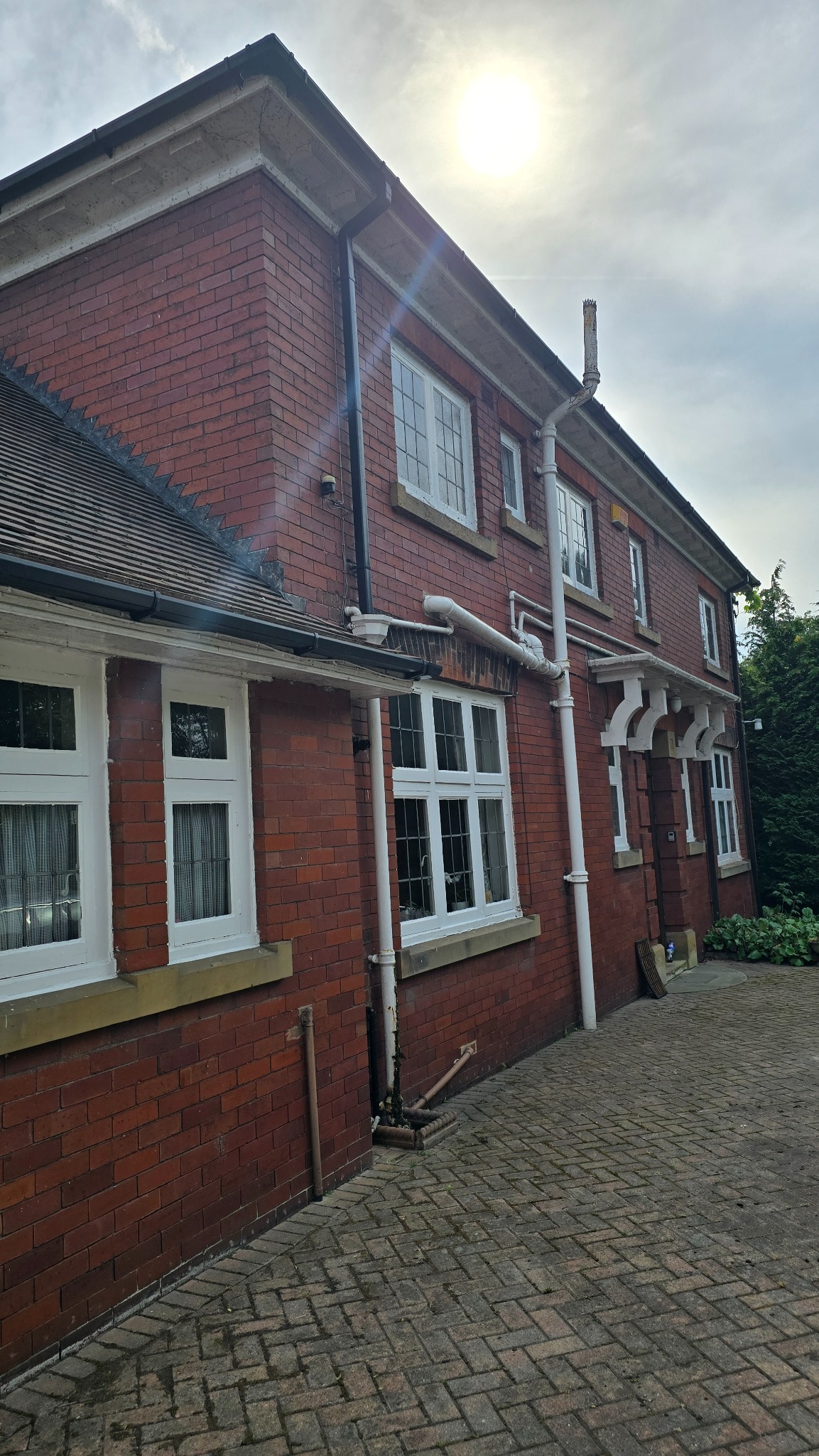 Large house in Ackworth after professional ivy removal exposed the brickwork and windows