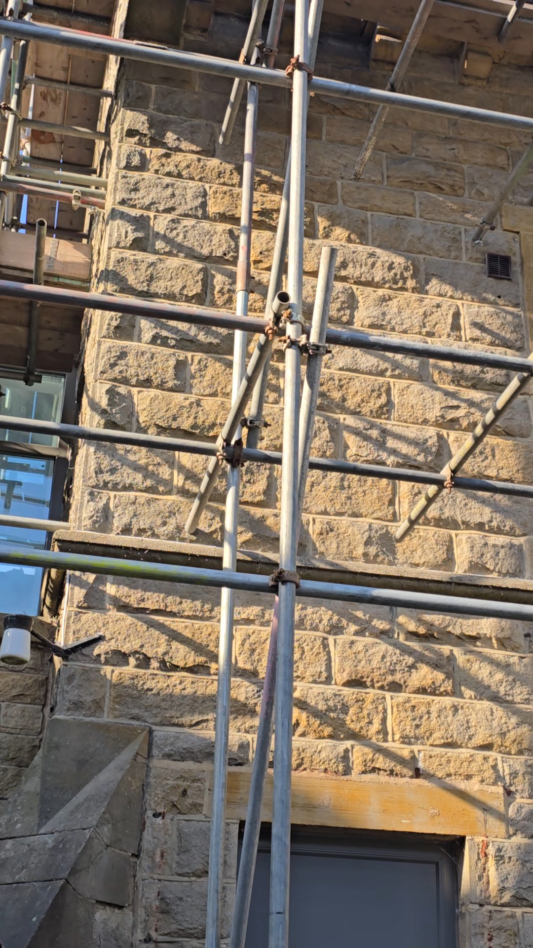 Rear stone wall after ivy removal from scaffolding at a property in Ilkley LS29